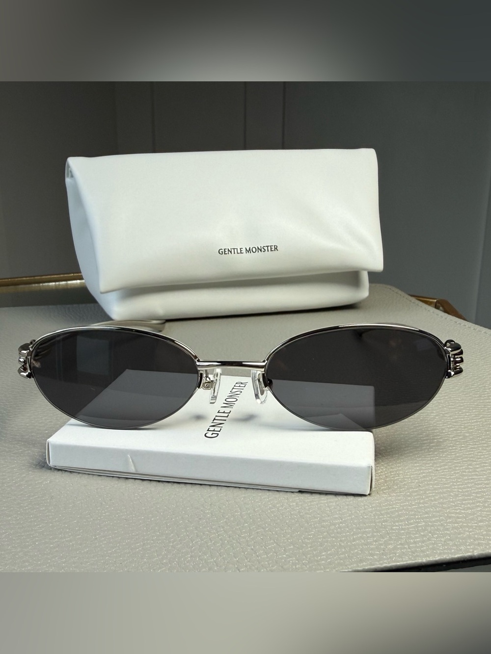 GENTLE MONSTER Oval Silver Frame Sunglasses with Black Lenses